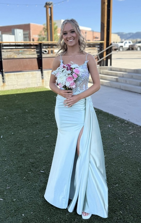 Photo of the model wearing a white gown